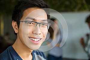 Closeup portrait of young positive asian man
