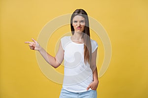 Closeup portrait of young pretty unhappy, serious woman pointing at someone as if to say you did something wrong, bad