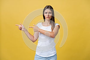 Closeup portrait of young pretty unhappy, serious woman pointing at someone as if to say you did something wrong, bad