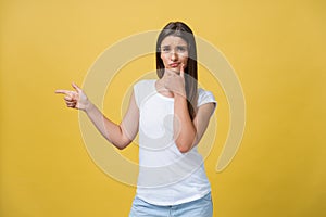 Closeup portrait of young pretty unhappy, serious woman pointing at someone as if to say you did something wrong, bad