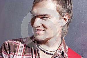 Closeup Portrait of Young Smiling Caucasian Guitar Player Posing