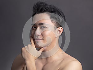 Closeup portrait of young smiling handsome man face