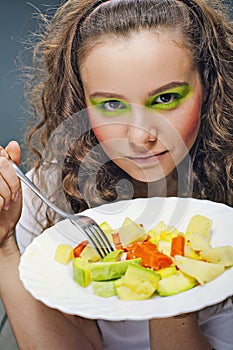 Closeup portrait of young woman eating