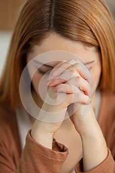 closeup portrait young woman praying