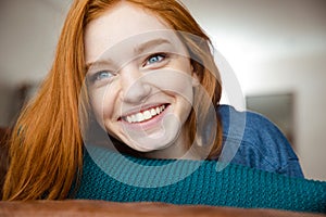 Closeup of positive young redhead woman