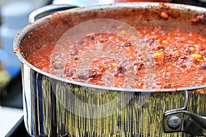 Closeup of a pot of chili cooking
