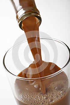 Closeup pouring chocolate milk