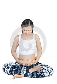 Closeup of a pregnant woman's sitting