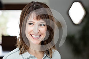 Closeup Of A Pretty Woman Smiling away at Home