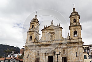 Closeup of the Primatial Cathedral against a cloudy sky in Bolivar Square, Bogota photo