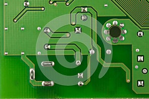 Closeup printed circuit board green there are a lot of conductive tracks