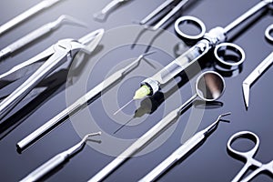 Closeup of professional dental tools on shiny table