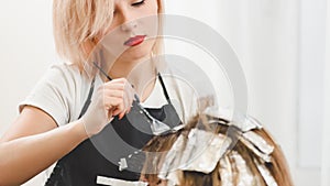 Hairdresser coloring hair