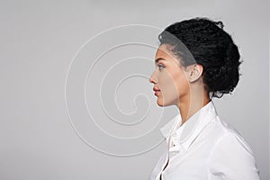 Closeup profile of business woman looking forward photo