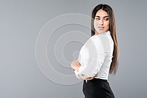 Closeup profile of confident business woman looking forward isolated on gray background photo