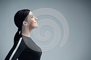 Closeup profile portrait of confident woman looking forward