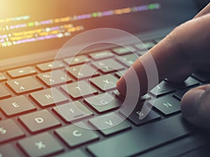 Closeup programmer coding on screen. Hands coding html and programming on laptop screen, web development, developer