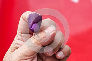 Closeup of purple indelible ink on index finger. Used in election in Malaysia to prevent fraud.