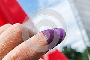 Closeup of purple indelible ink on index finger. Used in election in Malaysia to prevent fraud. photo