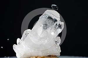 Closeup of a quartz crystal cluster on the black background