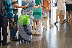 Closeup Queue of Asian people waiting at boarding gate at airport