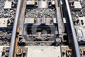 Closeup of Railroad intersections with alternating machines in countryside