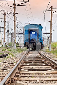closeup of railway track with train standing. Trains depart and arrive at Tomsk2