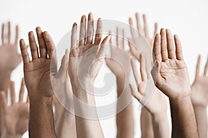 Closeup Of Raised Multiethnic Hands photo