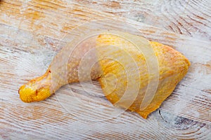 Closeup of raw chicken legs with garlic