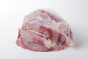 Closeup of raw pork ham on the white background.Fresh meat as an ingredient for cooking