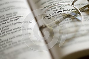 Closeup Reading Glasses On Open Bible