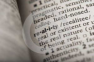 Closeup of `Reality` in a Dictionary