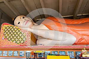 Closeup of the Reclining or Sleeping Buddha in Wat Phothivihan, Tumpat Kelantan, Malaysia photo