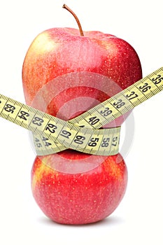 Closeup of a red apple with a measuring tape