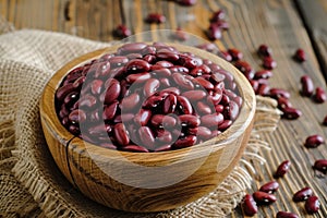 Closeup red beans or kidney bean in wooden bowl isolated on wood table background