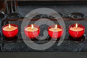 Closeup of red candles row