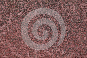 Closeup of a red carpet with rubber