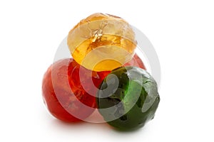 Closeup of red, green and yellow glace cherries isolated on whit