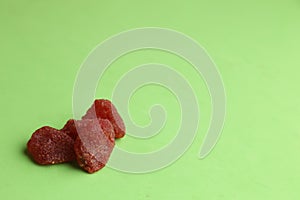 Closeup of red hard candies arranged aesthetically on one side photo