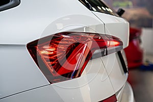 Closeup of a red led taillight on a modern car, detail on the rear light of a car