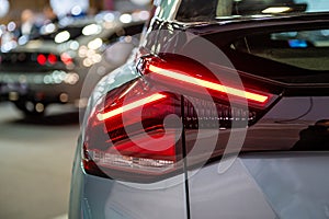 Closeup of a red led taillight on a modern car, detail on the rear light of a car