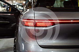 Closeup of a red led taillight on a modern car, detail on the rear light of a car