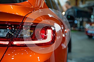 Closeup of a red led taillight on a modern car, detail on the rear light of a car