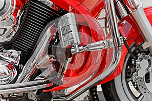 Closeup of red motorcycle. Beautiful modern red motorcycle headlights details..