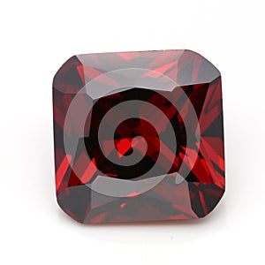 Closeup of a red ruby gemstone isolated on a white background