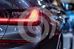 Closeup of a red taillight on a modern car, detail on the rear light of a car