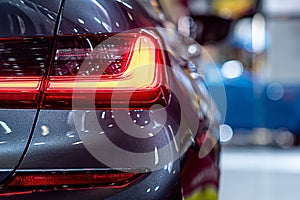 Closeup of a red taillight on a modern car, detail on the rear light of a car