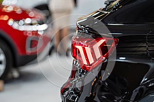 Closeup of a red taillight on a modern car, detail on the rear light of a car