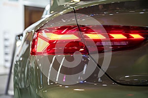 closeup of a red taillight on a modern car, detail on the rear light of a car