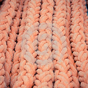 Closeup of red thick ropes on sailboat or ship
